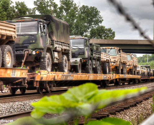 Army Trucks on A Train