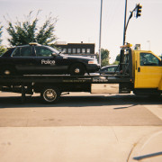 KCPD Police Patrol Car on Tow Truck