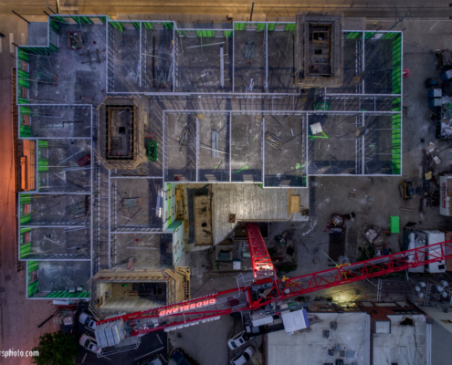 Flying Camera Above Kansas City Construction Site OR A Flying Camera Above Central Bank Quantitative Easing; A new-fangled Hampton Inn at approx. 16th and Main, Kansas City, Missouri; post foundational yet pre-roofing. Summer 2018. 